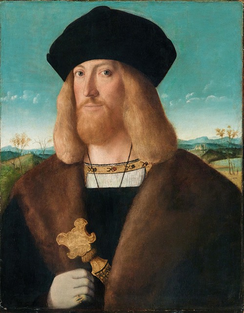 Portrait Of A Bearded Man, Half-Length, Wearing A Fur-Lined Coat And Holding A Dagger, A Landscape Beyond