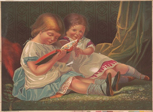 Two young girls reading book