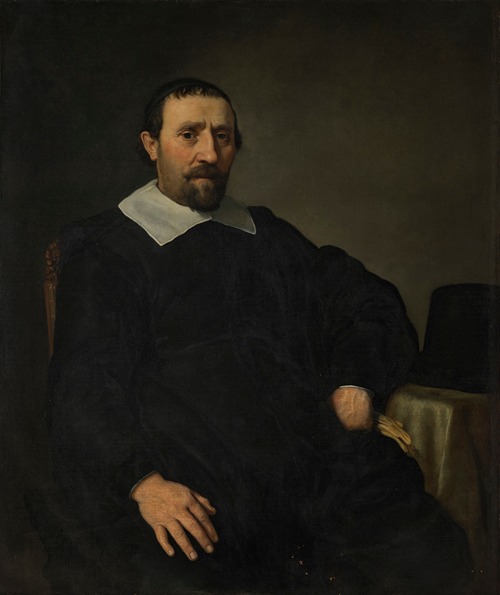 Portrait of a gentleman, seated at a table