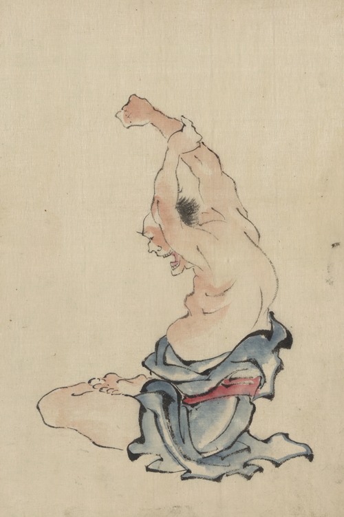 A man, bare-chested, sitting cross-legged with arms raised over his head, stretching or practicing yoga