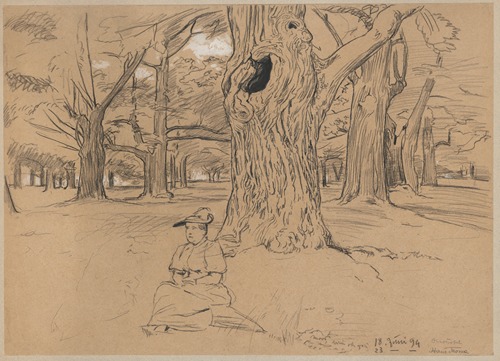 View of a park in Oberursel with a woman in a hat sitting under a tree