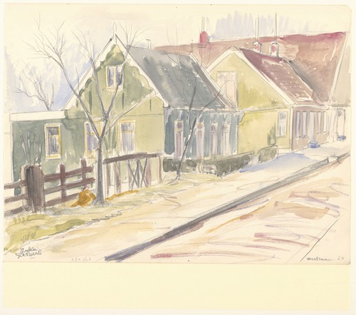 Groen geschilderde Zaanse-huizen aan het Zuideinde in Westzaan