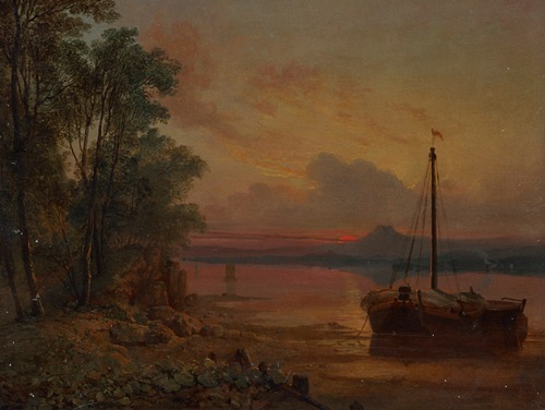 An estuary at sunset with a moored fishing boat in the foreground