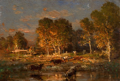 Cows drinking at sunset