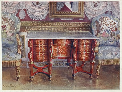 Kneehole writing table in red tortoiseshell. Lacquer steel top. Boulle. Gilt fauteuils, upholstered in tapestry (1910 - 1911)