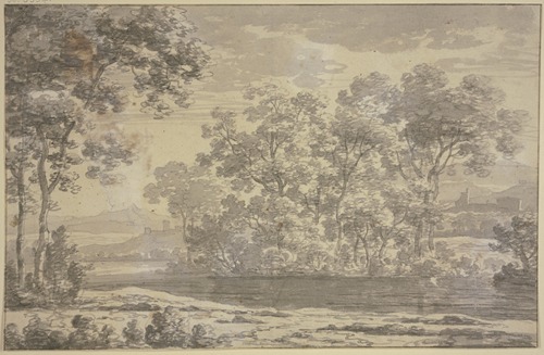 Group of trees near a water, with buildings in the middle ground and a mountain range in the background