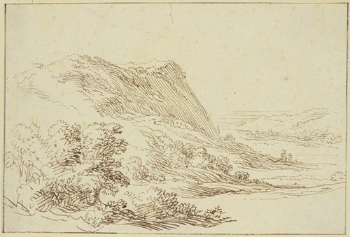 Landschaft, links ein Berg und Sträucher, rechts ein Tal im Hintergrund