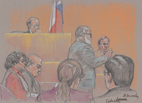 Lawyer speaking in front of judge, witness and others during trial of Yolanda Saldivar for the murder of the singer Selena