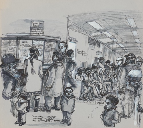 Interior view of a corridor at the Kings County Housing Court with many people of all ages waiting outside the “Housing Courtroom”