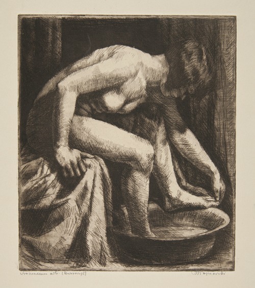 Nude woman washing her feet