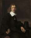 A Young Man Seated at a Table (possibly Govaert Flinck)