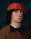 A Young Man In A Red Cap