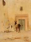 Arab and a donkey at the wall of a house
