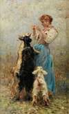 Young woman feeding goats