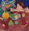 Little girl at a table with fruit