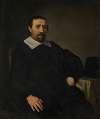 Portrait of a gentleman, seated at a table