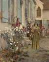 Young woman near a house with rose bushes