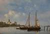 Moored fishing boats with windmills in the background