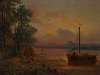 An estuary at sunset with a moored fishing boat in the foreground
