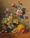 Still life with a camelia spray, cornflowers and grapes in a silver bowl, with nuts, an orange and red peppers, all on a marble ledge
