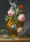 Still life of roses and other flowers in an antique vase decorated with putti, all upon a ledge