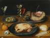 A Still Life Of A Roast Chicken, A Ham And Olives On Pewter Plates With A Bread Roll, An Orange, Wineglasses And A Rose On A Wooden Table