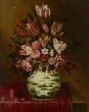 Still life with flowers in a porcelain vase on a draped table