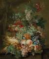 Grapes, peaches, sweetcorn, a pineapple, poppies and other fruit and flowers in a wicker basket on a ledge