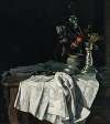 Still life with a white tablecloth and a silver candlestick