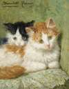 Two Kittens Sitting On A Cushion