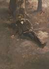 Man sitting on ground under tree