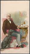 Older gentleman sitting in a chair, holding a glass of beverage, with a black dog sitting next to him